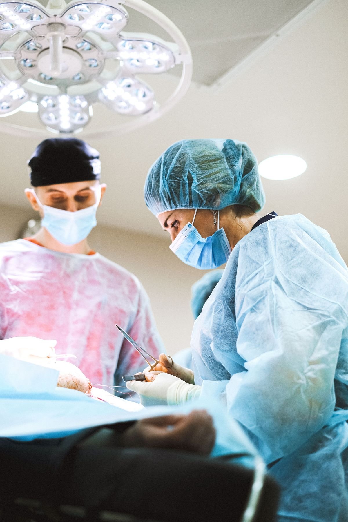 Healthcare contract negotiation specialist reviewing payer rate agreements